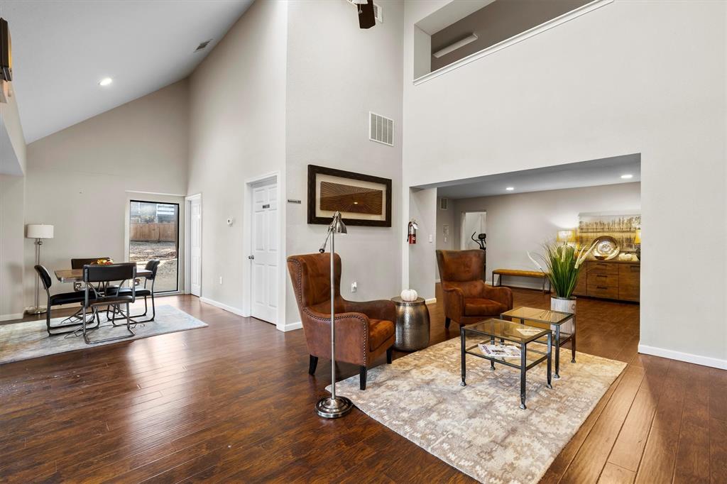 5840 Spring Valley Road, Unit 912 Dallas, TX 75254 - Photo 27 of 33 a living room with furniture a rug and a flat screen tv