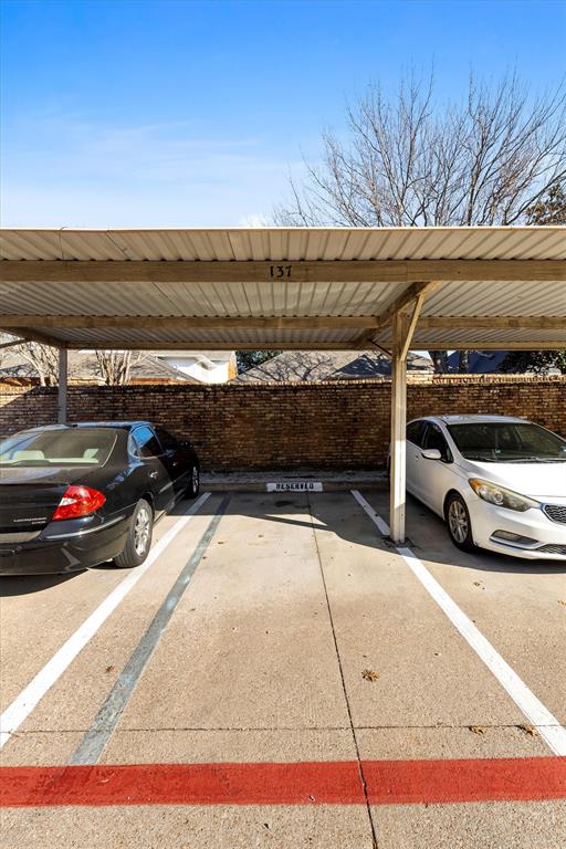5840 Spring Valley Road, Unit 912 Dallas, TX 75254 - Photo 30 of 33 a view of parking with cars parked