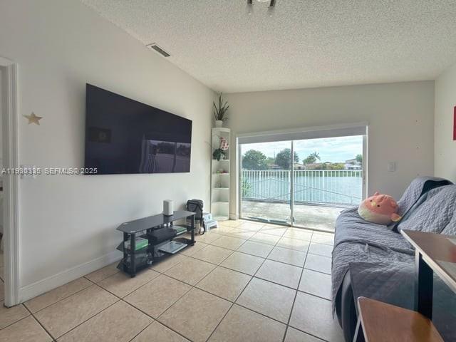 16955 Southwest 142nd Place Miami, FL 33177 - Photo 12 of 29 a living room with furniture and a flat screen tv