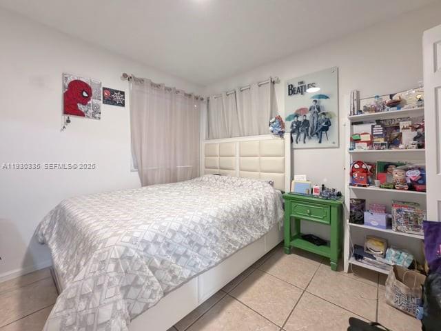 16955 Southwest 142nd Place Miami, FL 33177 - Photo 16 of 29 a bedroom with a bed and a window