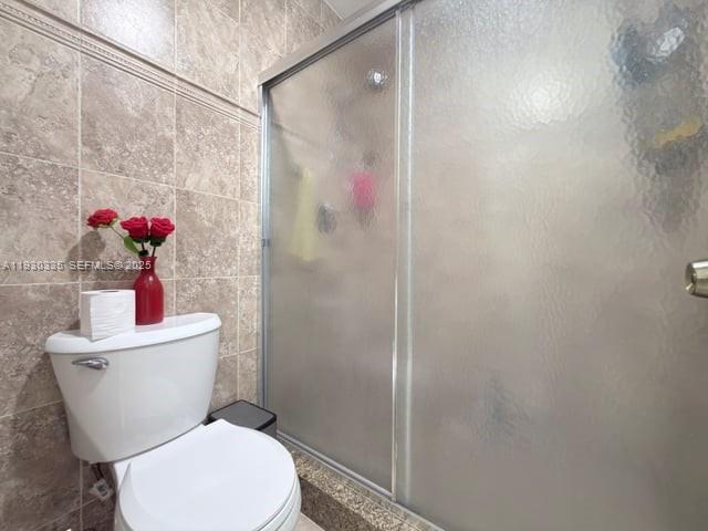 16955 Southwest 142nd Place Miami, FL 33177 - Photo 19 of 29 a white toilet sitting next to a bathroom sink