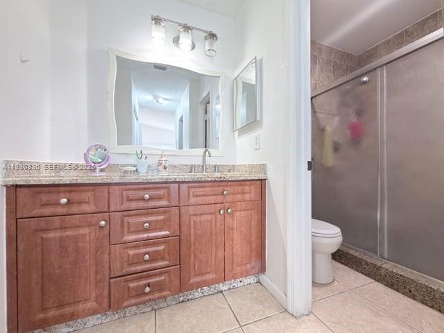 16955 Southwest 142nd Place Miami, FL 33177 - Photo 20 of 29 a bathroom with a granite countertop sink toilet and shower