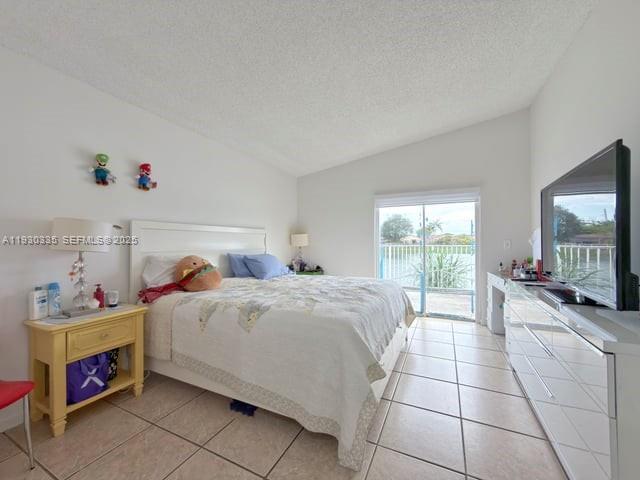 16955 Southwest 142nd Place Miami, FL 33177 - Photo 22 of 29 a bedroom with a bed and a flat screen tv