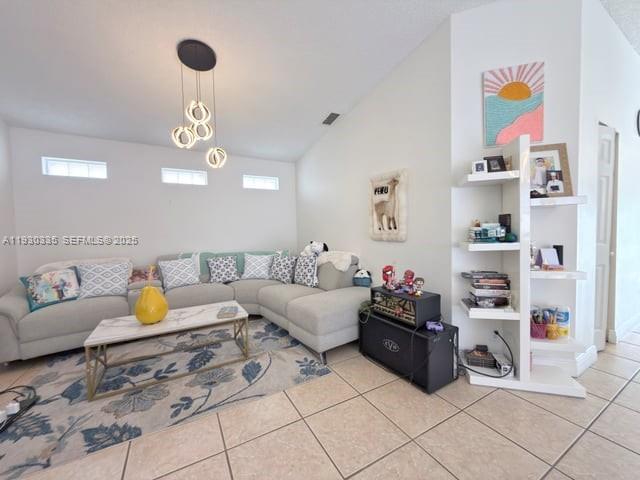 16955 Southwest 142nd Place Miami, FL 33177 - Photo 28 of 29 a living room with furniture and a chandelier