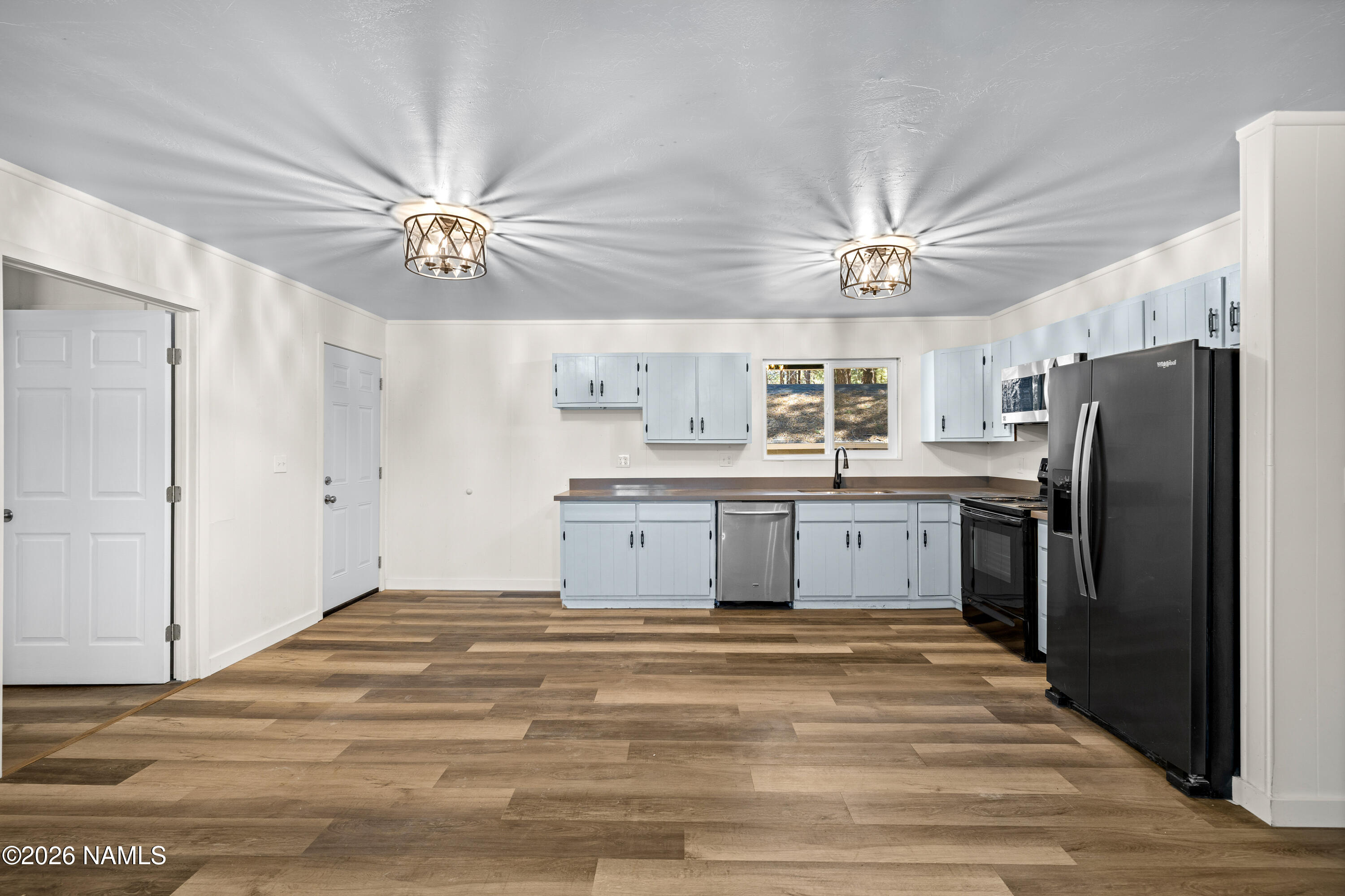 874 Oneida Flagstaff, AZ 86005 - Photo 16 of 30 a kitchen with a refrigerator a sink and dishwasher