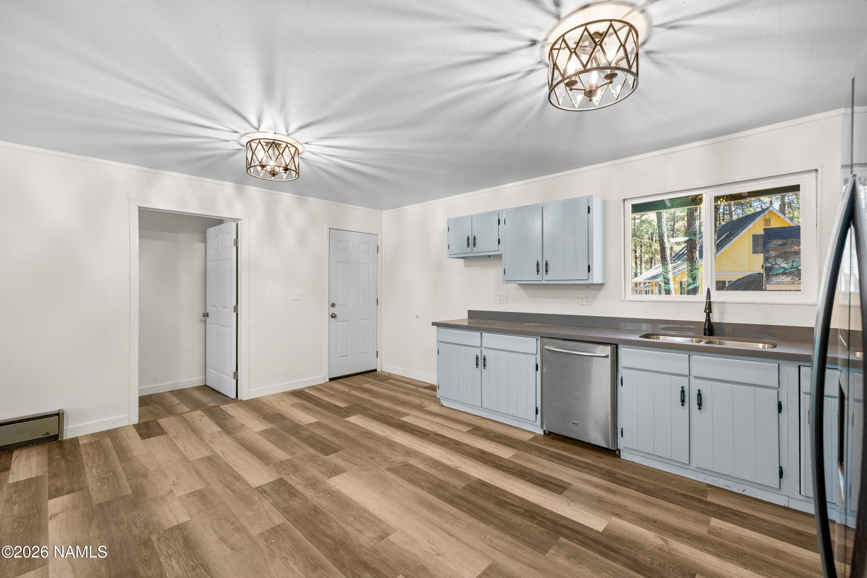 874 Oneida Flagstaff, AZ 86005 - Photo 18 of 30 a spacious bathroom with a granite countertop sink a mirror and a bathtub