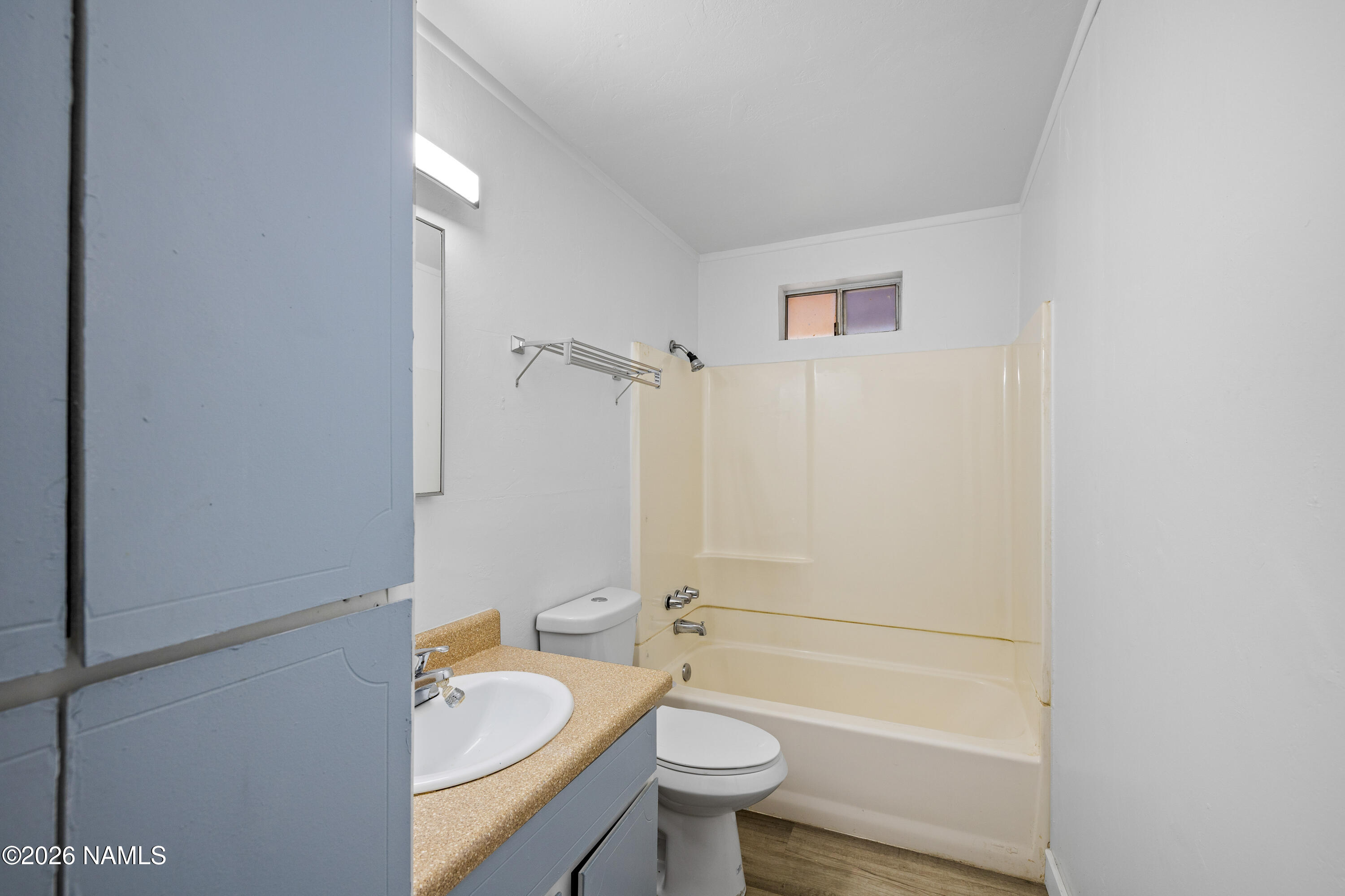 874 Oneida Flagstaff, AZ 86005 - Photo 26 of 30 a bathroom with a sink a toilet and shower