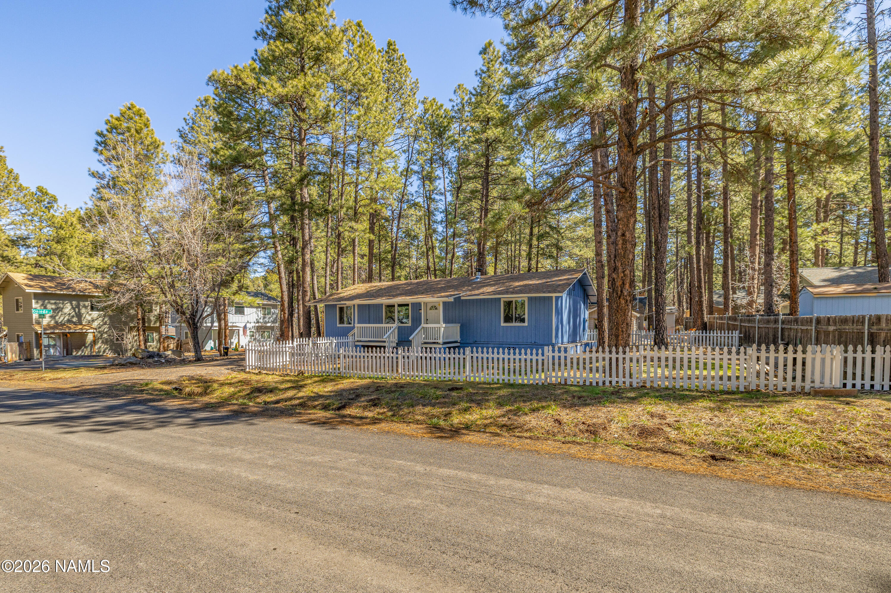 874 Oneida Flagstaff, AZ 86005 - Photo 4 of 30 a view of a house with a large tree