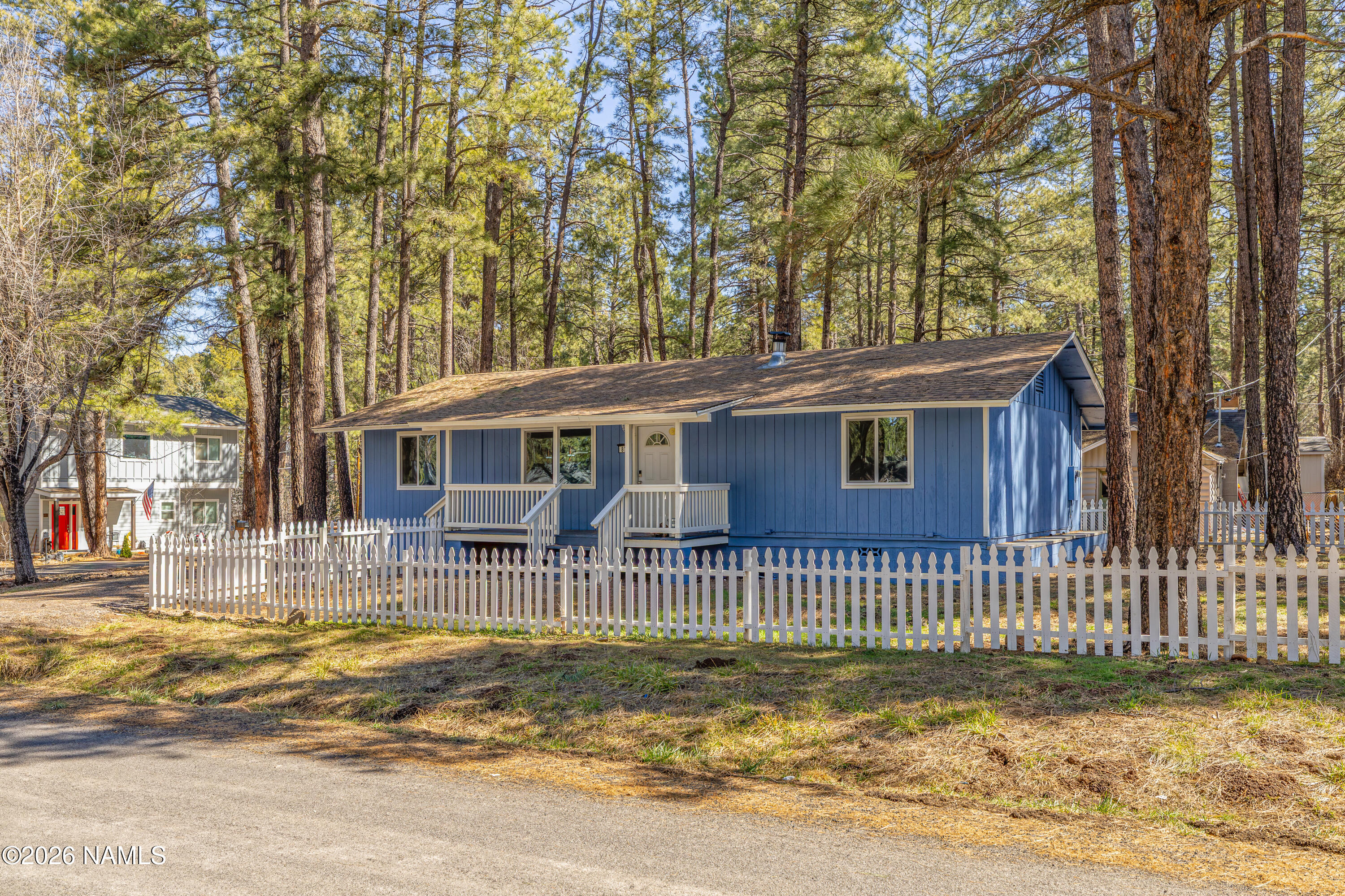 874 Oneida Flagstaff, AZ 86005 - Photo 5 of 30 a front view of a house with a garden