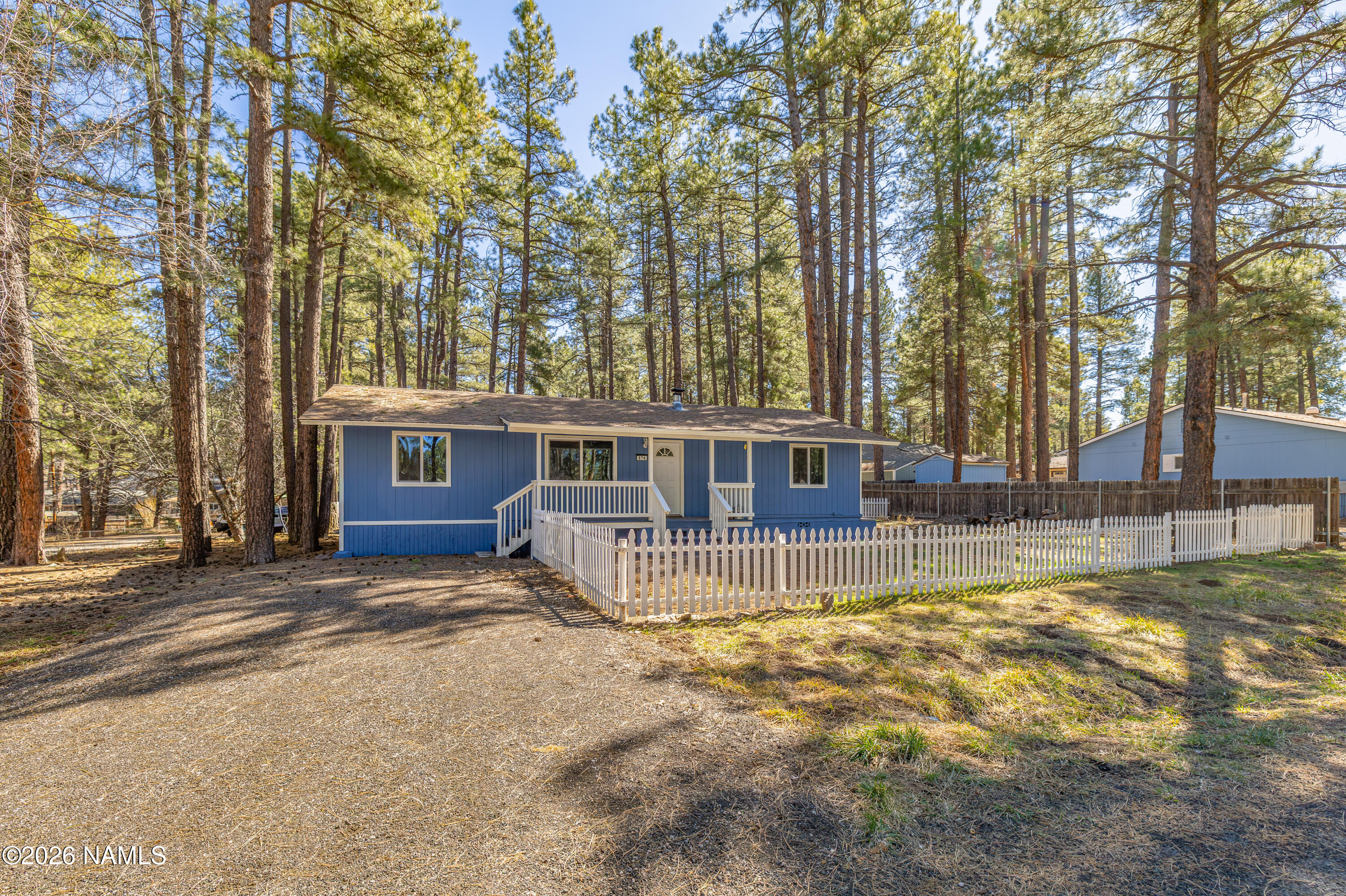 874 Oneida Flagstaff, AZ 86005 - Photo 6 of 30 a view of a house with backyard and sitting area