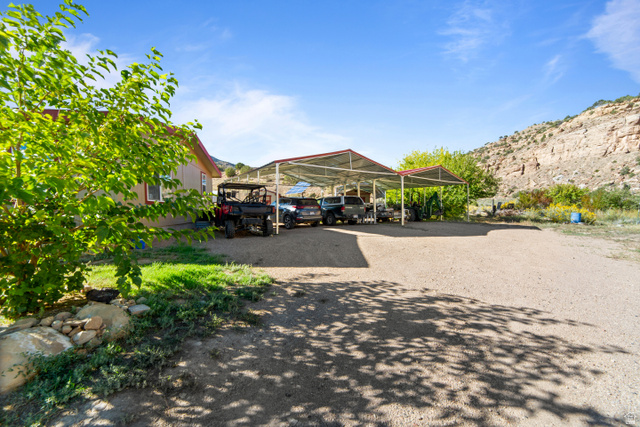3135 North Thompson Cyn Road Green River, UT 84525 - Photo 12 of 41 View of parking / parking lot with a carport