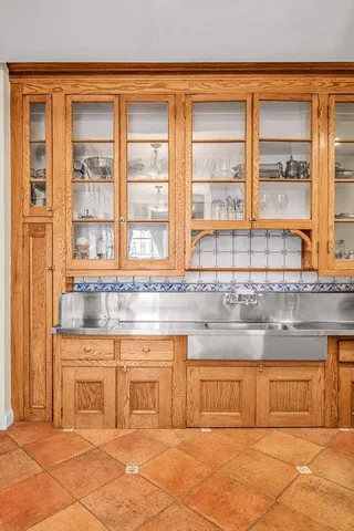 a kitchen with stainless steel appliances granite countertop a sink and a stove