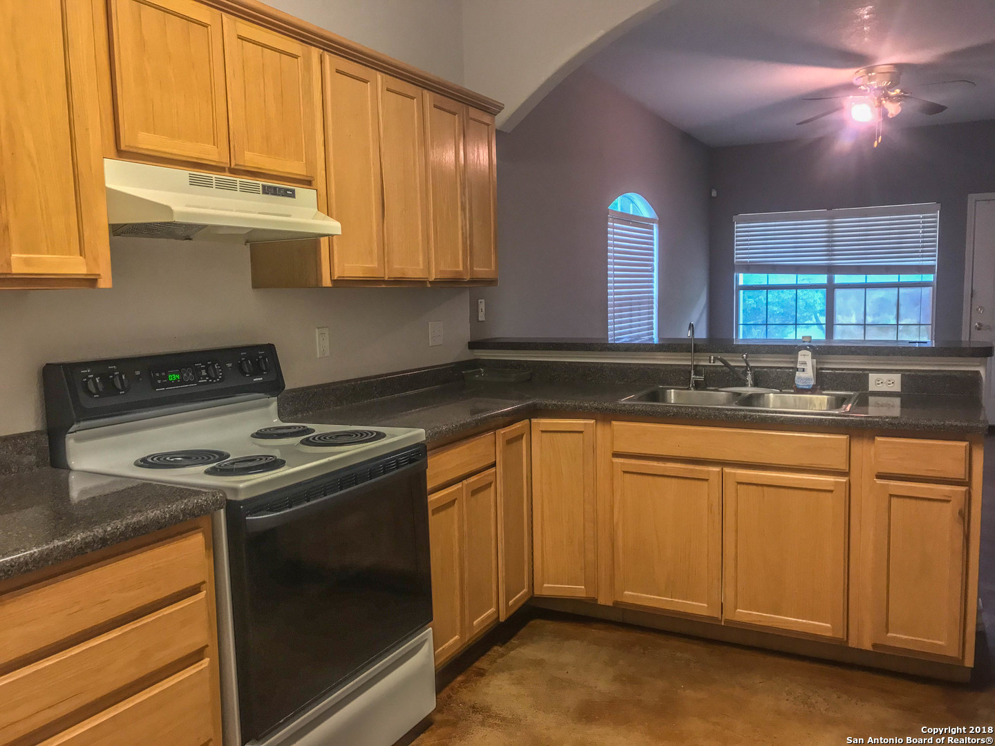 a kitchen that has a sink and a stove