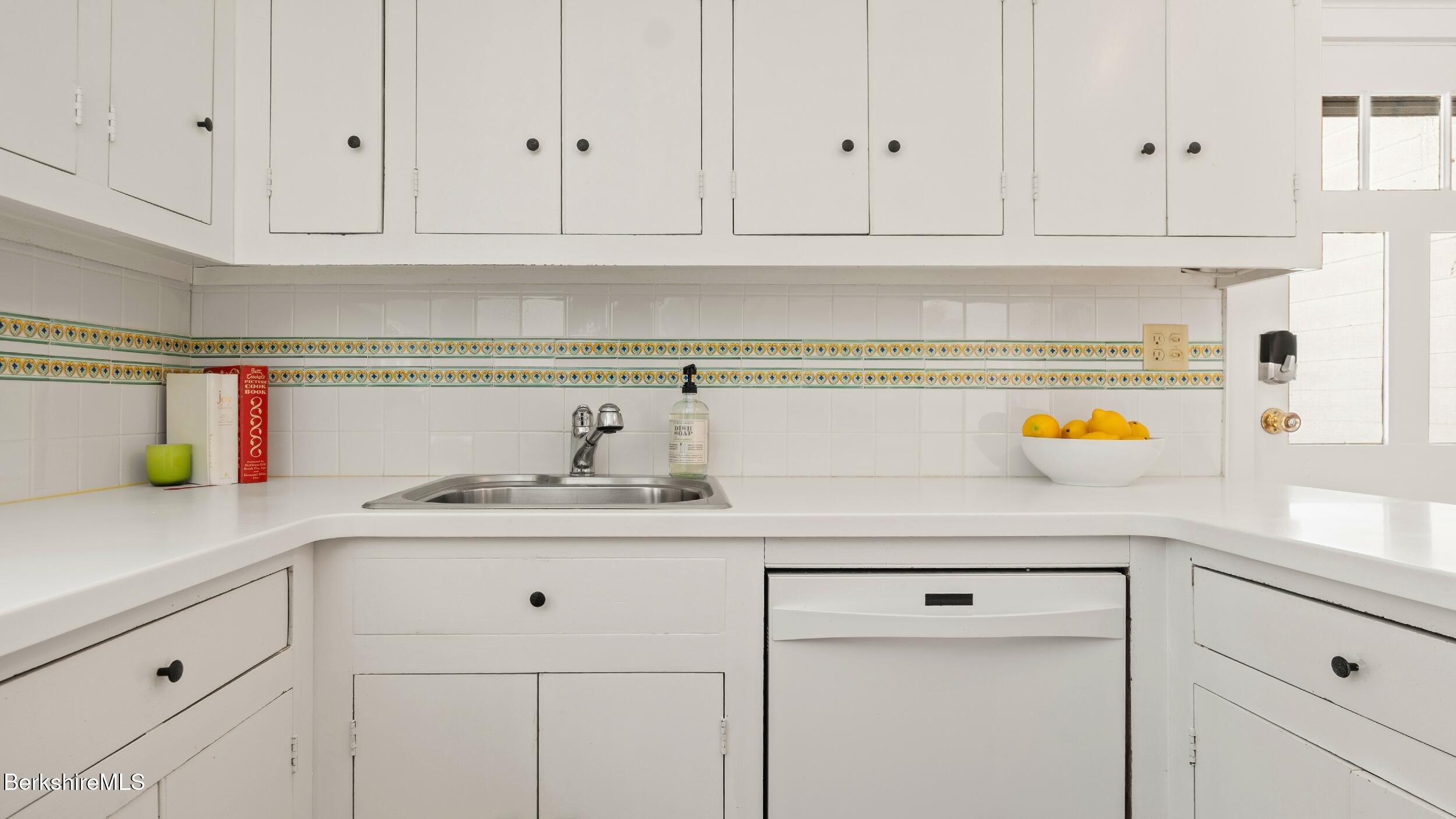 12 Alford Center Road Alford, MA 01266 - Photo 13 of 46 a kitchen with white cabinets and a sink