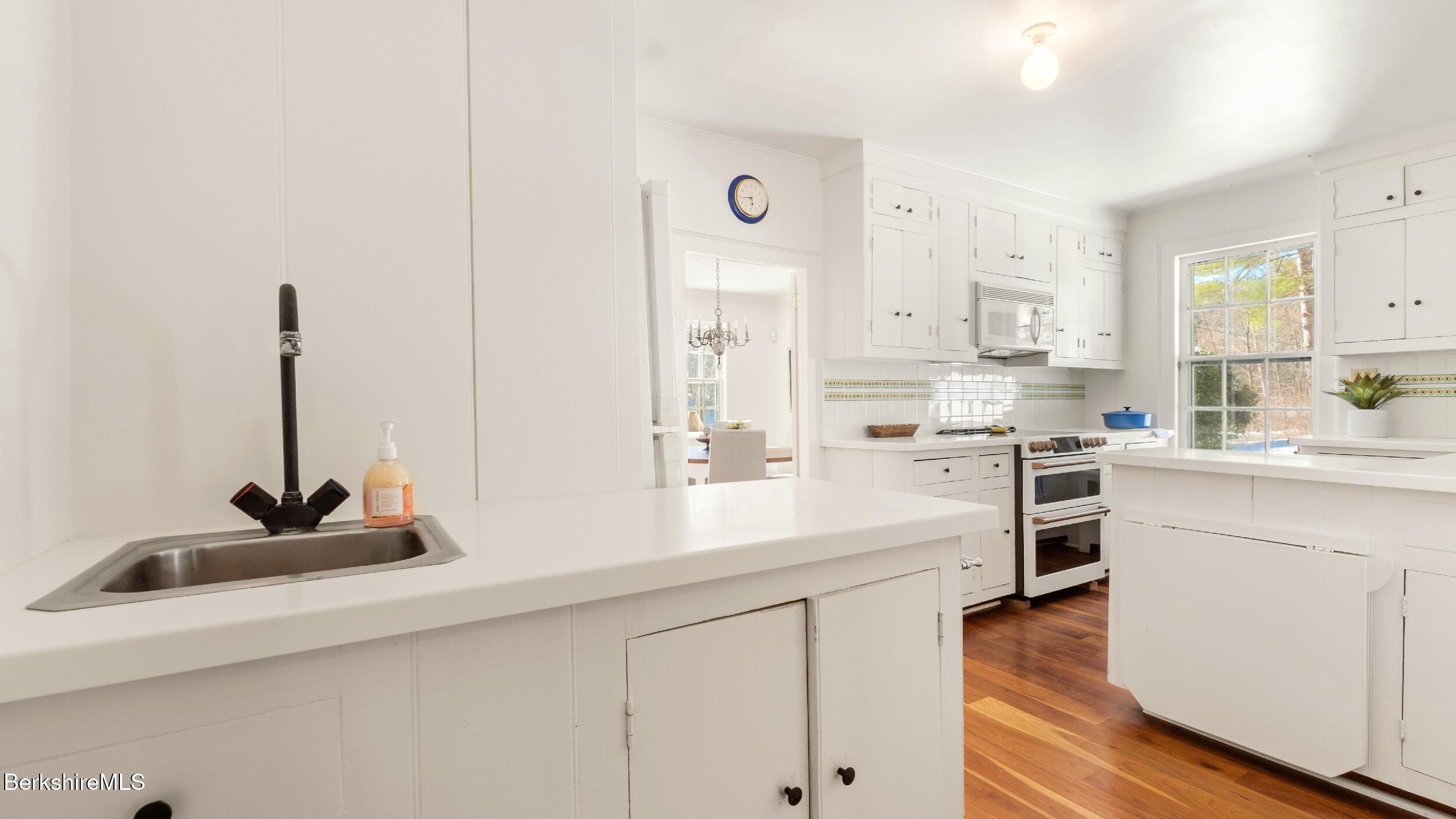 12 Alford Center Road Alford, MA 01266 - Photo 16 of 46 a kitchen with white cabinets and appliances
