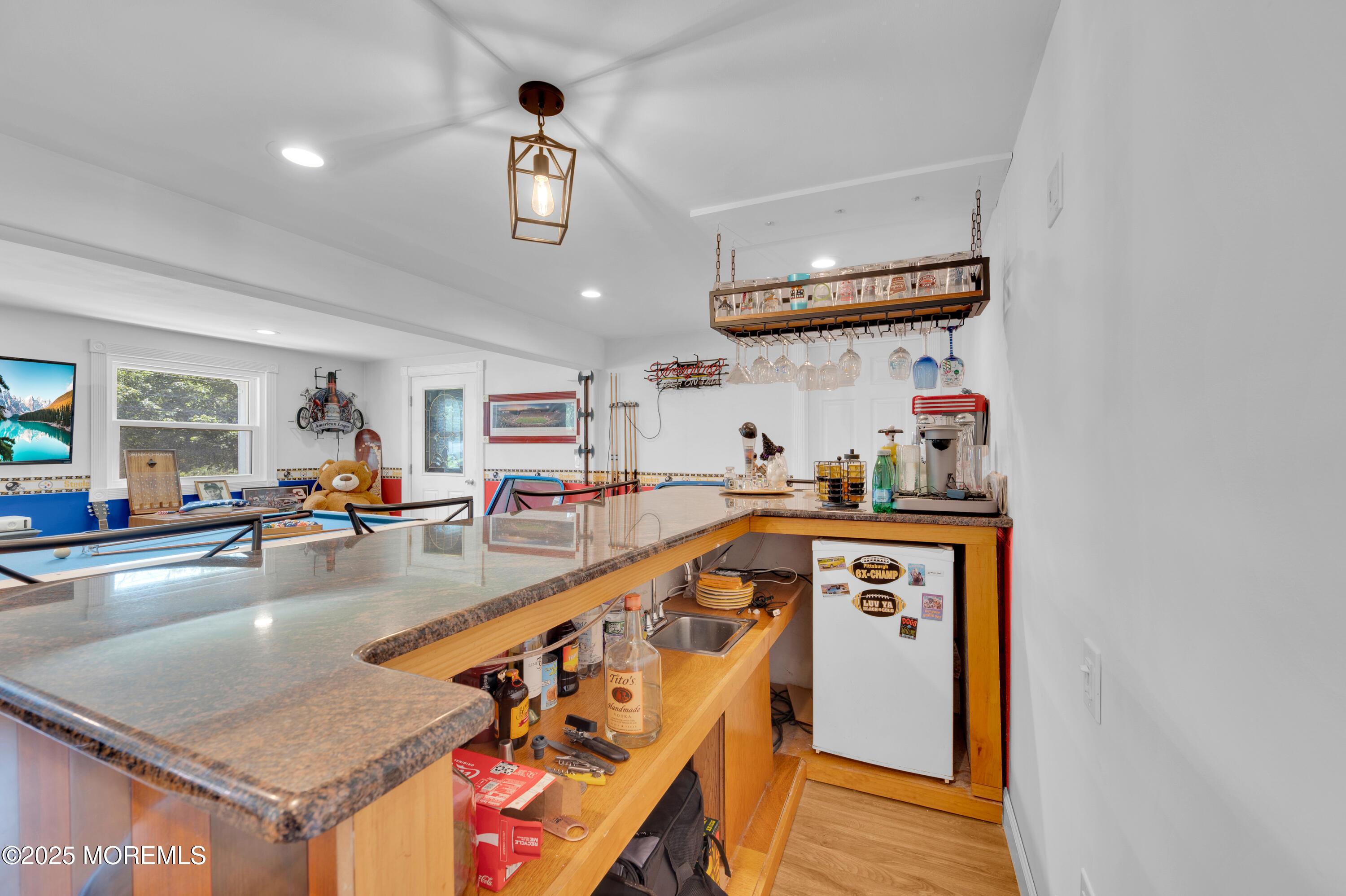 348 Hilltop Road Toms River, NJ 08753 - Photo 12 of 48 a kitchen with stainless steel appliances granite countertop a sink dishwasher stove and refrigerator with wooden floor