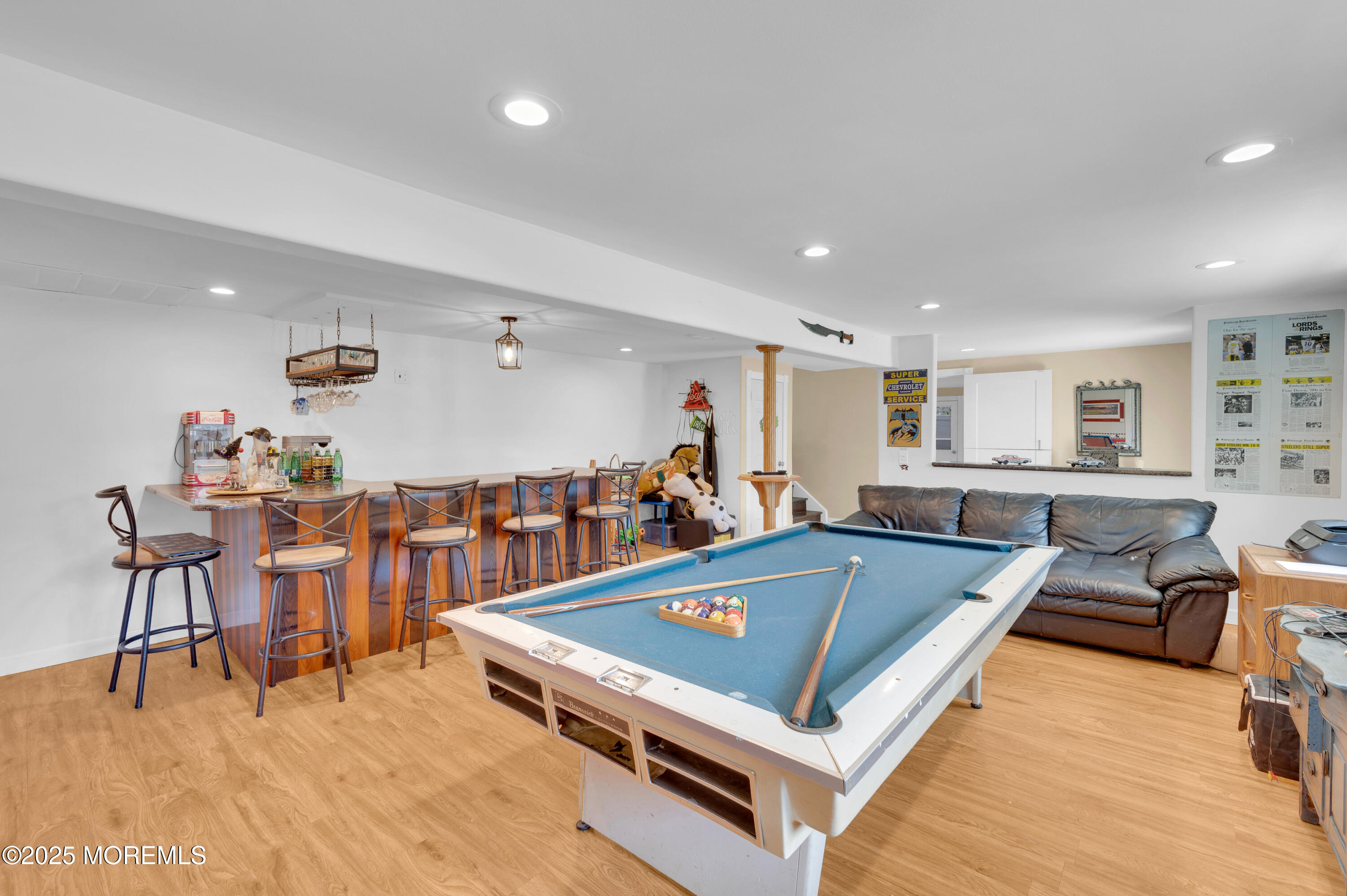 348 Hilltop Road Toms River, NJ 08753 - Photo 14 of 48 a living room with stainless steel appliances lots of furniture and wooden floor