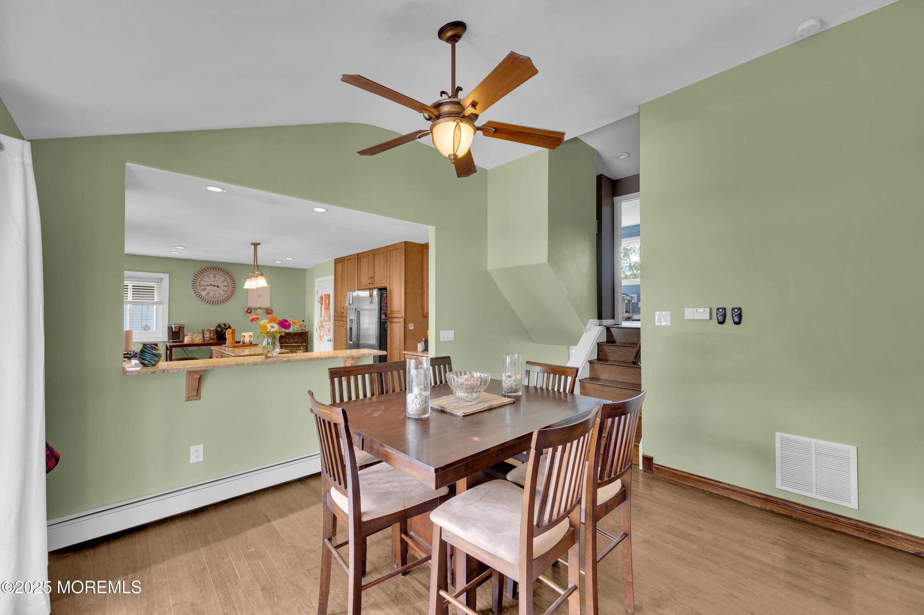 348 Hilltop Road Toms River, NJ 08753 - Photo 15 of 48 a view of a dining room with furniture and a chandelier fan