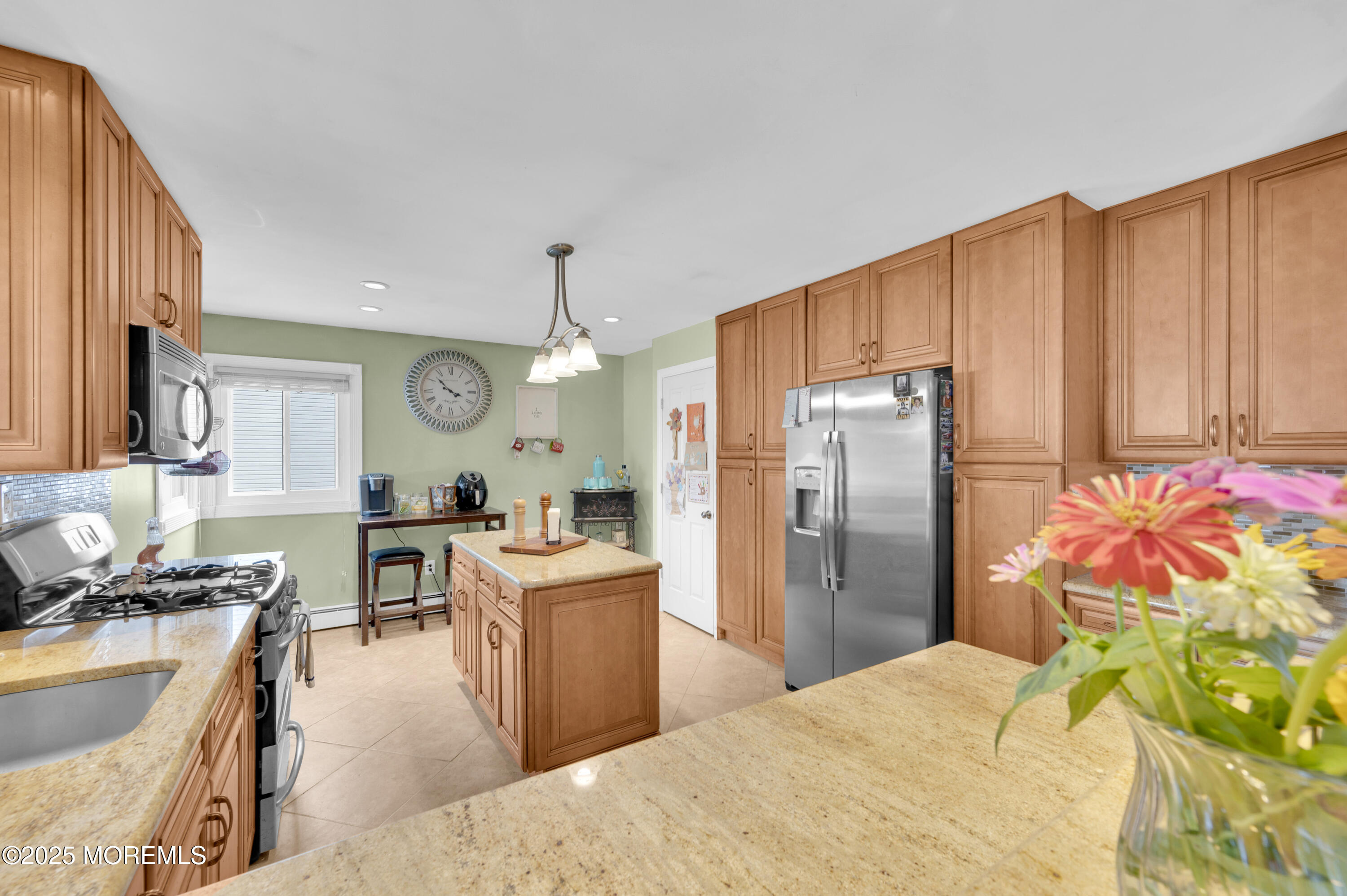 348 Hilltop Road Toms River, NJ 08753 - Photo 20 of 48 a kitchen with stainless steel appliances kitchen island granite countertop a sink stove and refrigerator