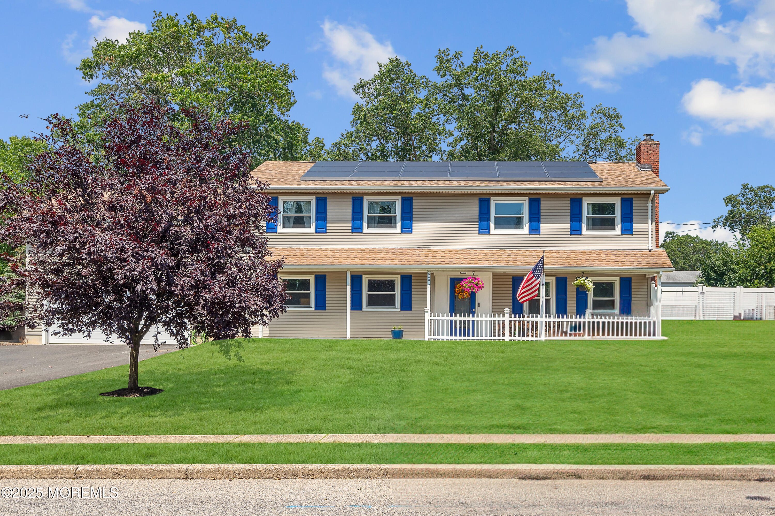 348 Hilltop Road Toms River, NJ 08753 - Photo 2 of 48 a front view of a house with a garden and trees