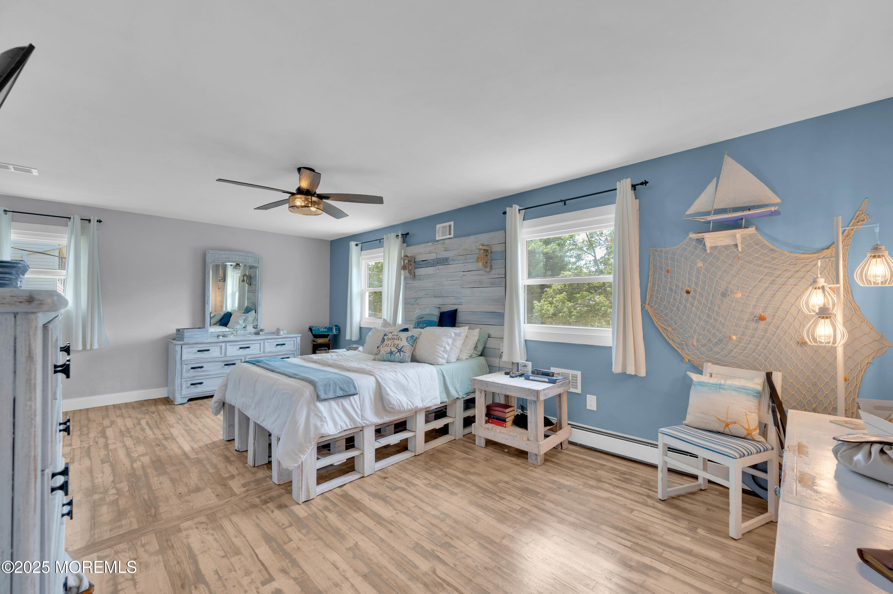 348 Hilltop Road Toms River, NJ 08753 - Photo 29 of 48 a bedroom with a bed and a chandelier