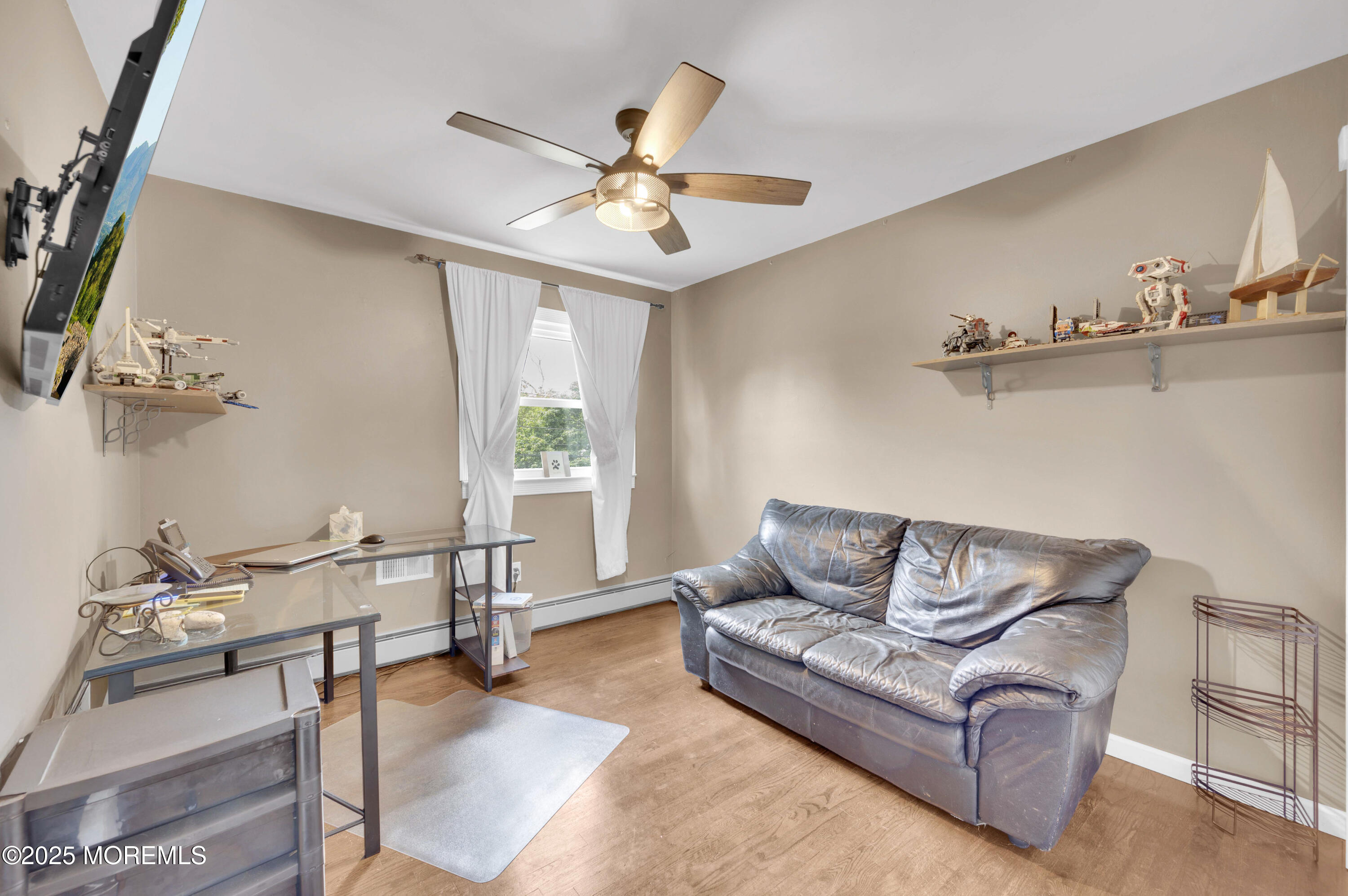 348 Hilltop Road Toms River, NJ 08753 - Photo 33 of 48 a living room with furniture and a chandelier