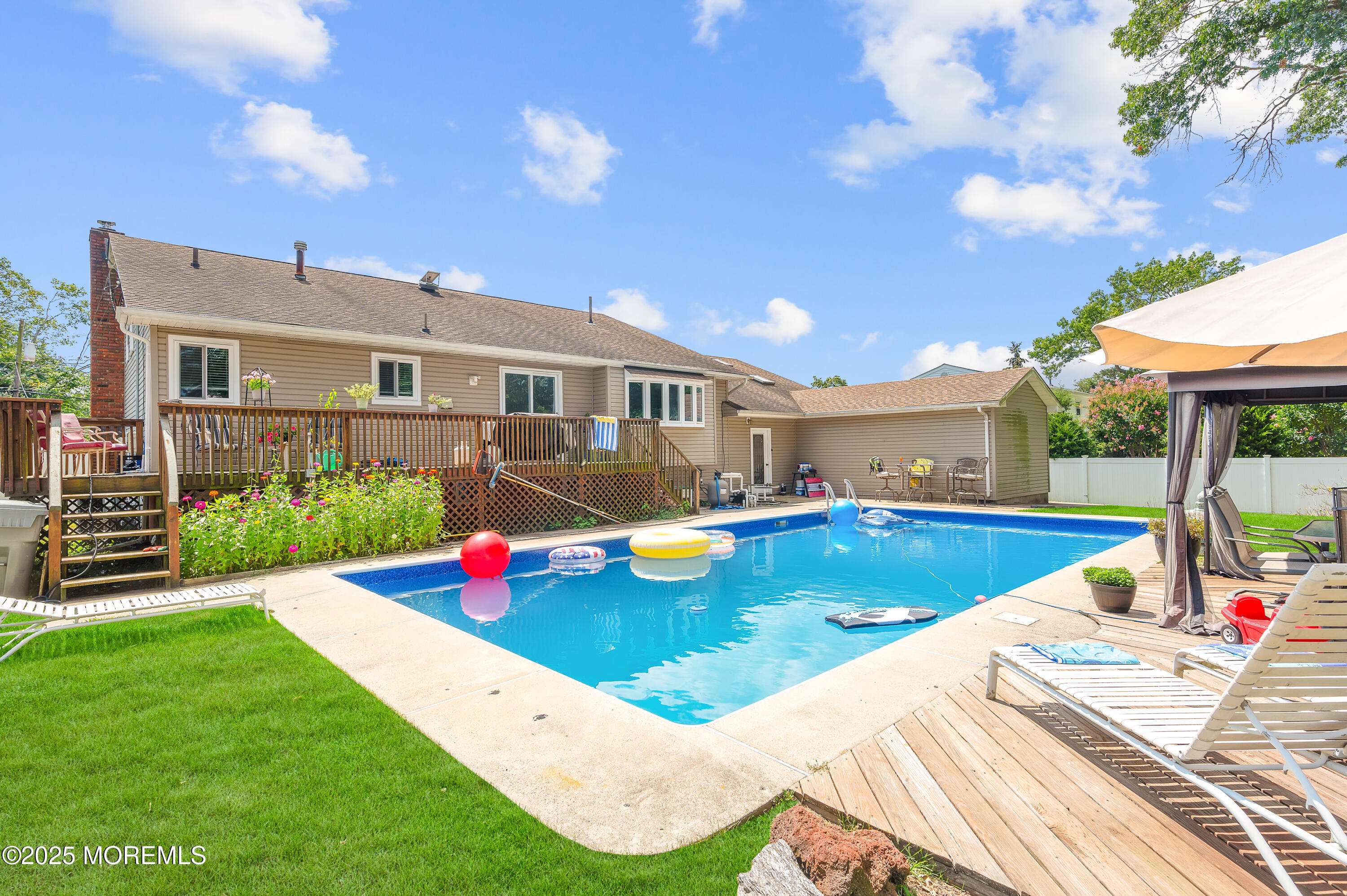 348 Hilltop Road Toms River, NJ 08753 - Photo 39 of 48 a view of a house with swimming pool and a yard