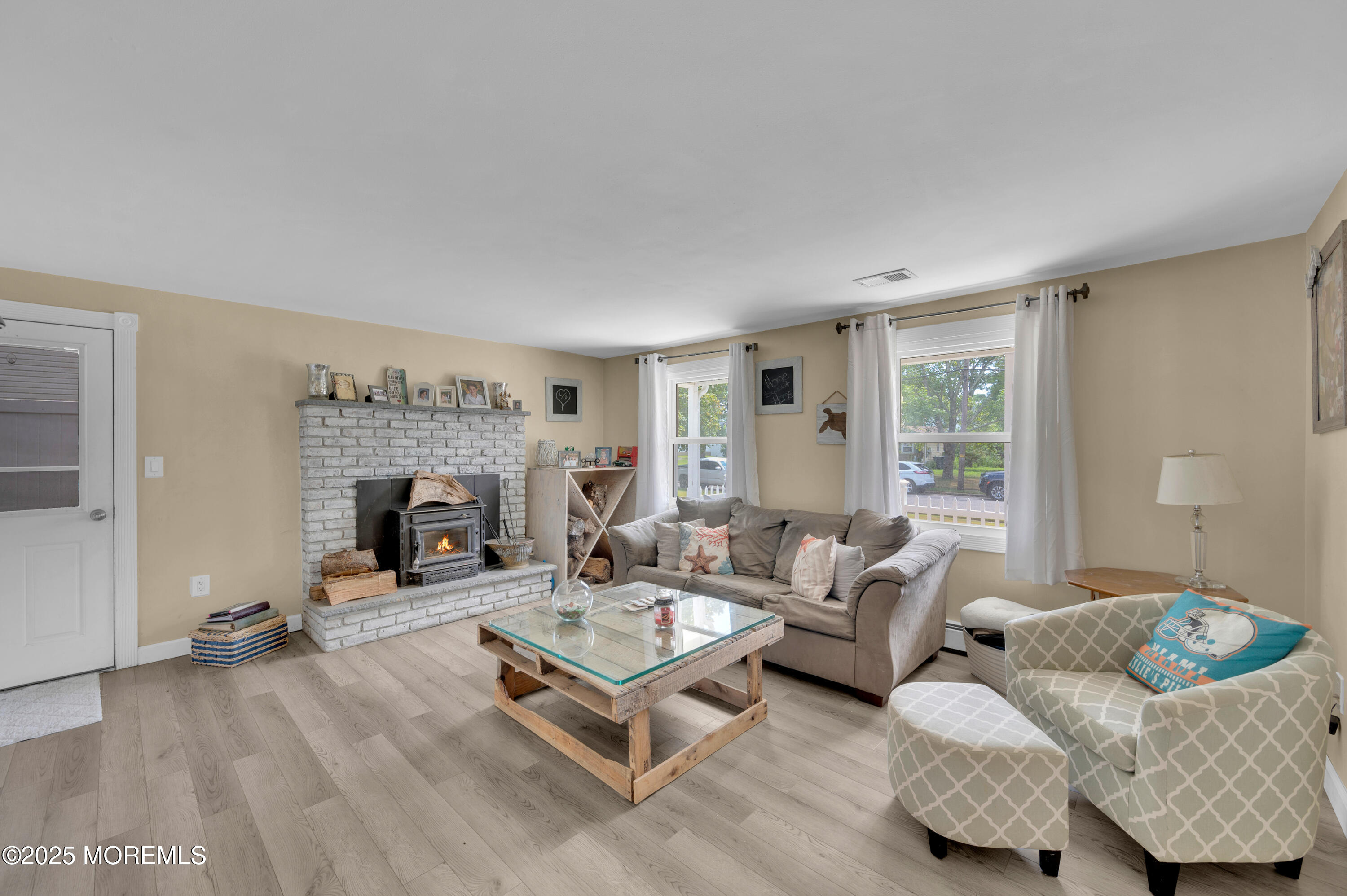 348 Hilltop Road Toms River, NJ 08753 - Photo 6 of 48 a living room with furniture and a fireplace