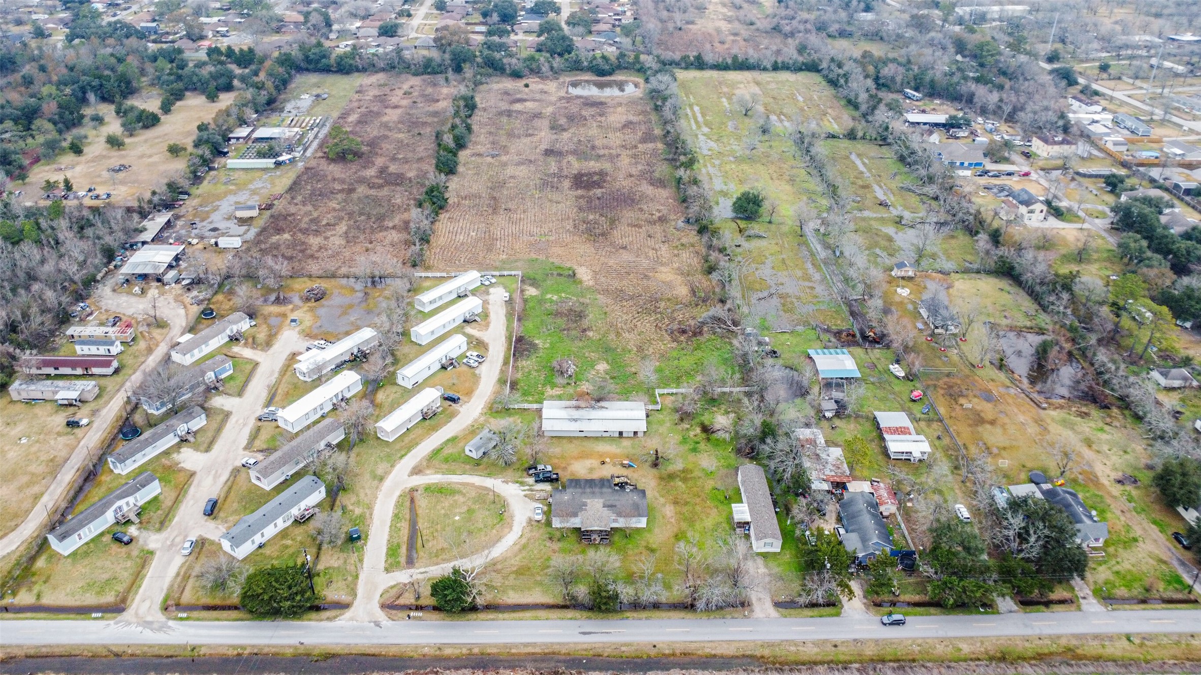 1300 North Battlebell Road Highlands, TX 77562 - Photo 2 of 16 an aerial view of a multi story building