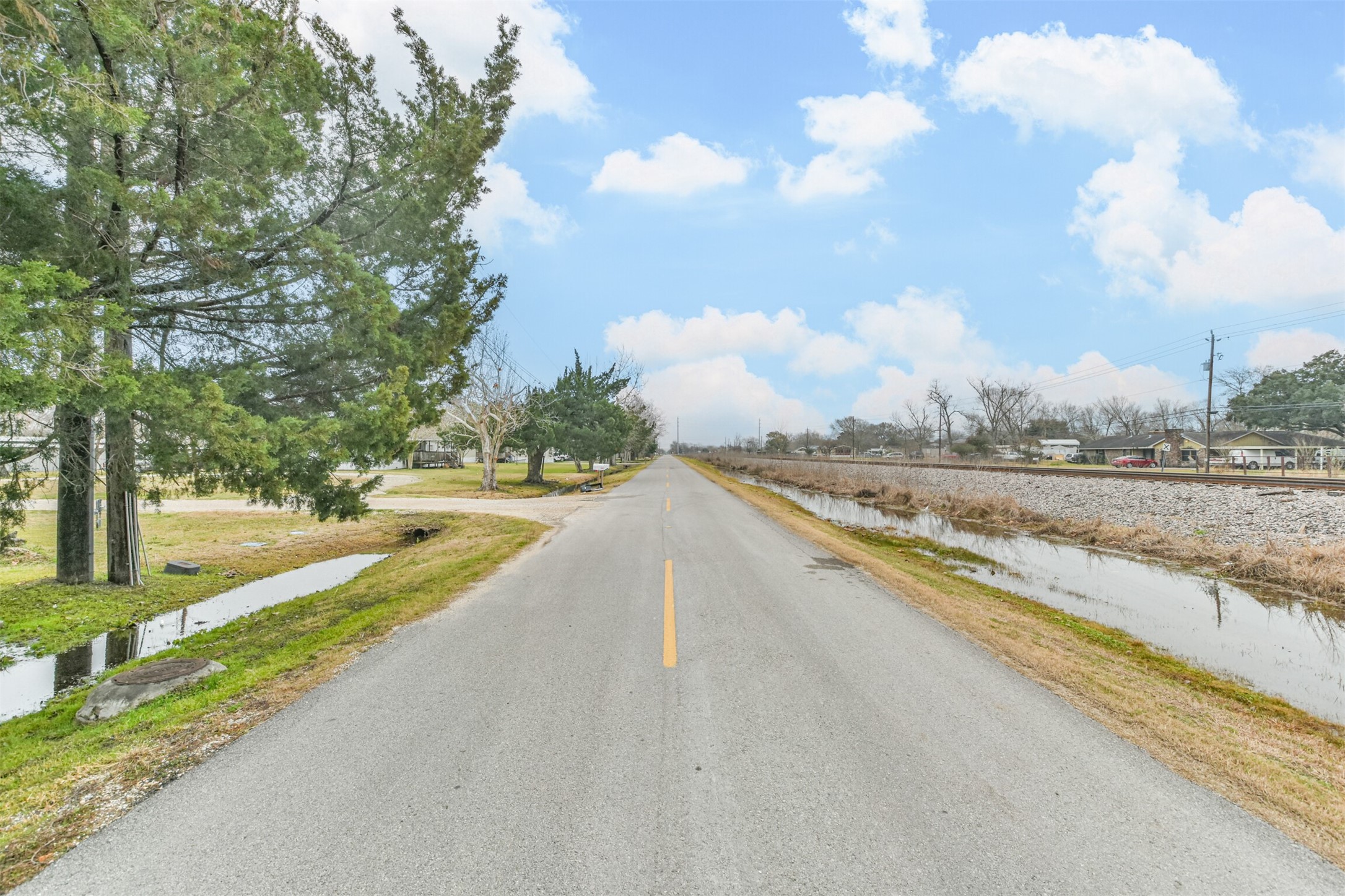 1300 North Battlebell Road Highlands, TX 77562 - Photo 10 of 16 a view of a lake with a big yard