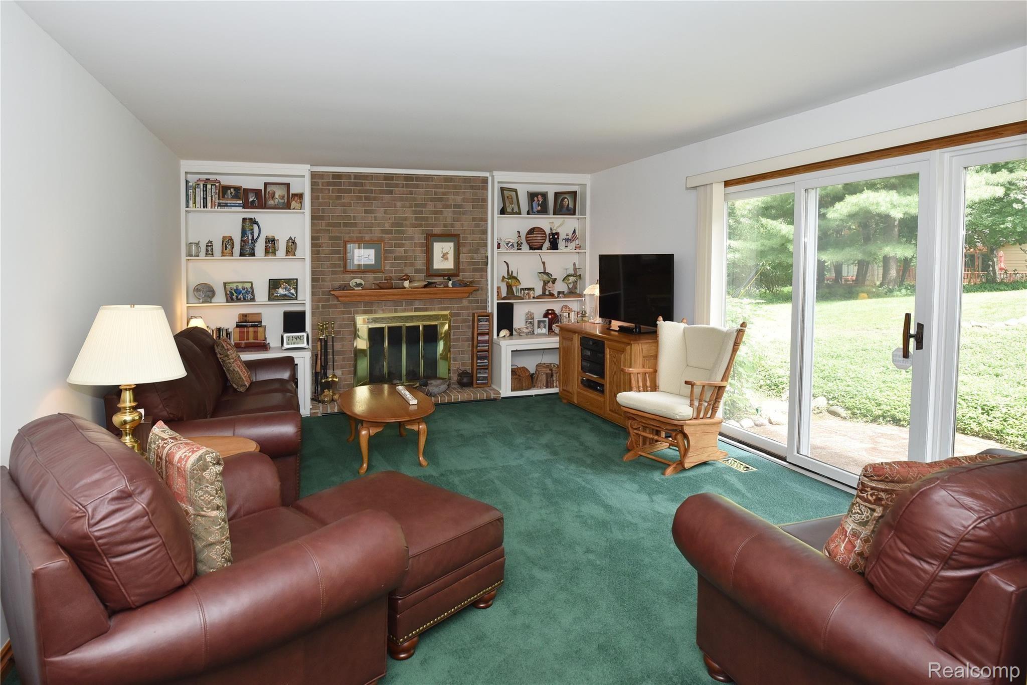 2962 Mohawk Lane Rochester, MI 48306 - Photo 16 of 28 Family Room w/ Natural Gas Fireplace and walkout to beautiful backyard!