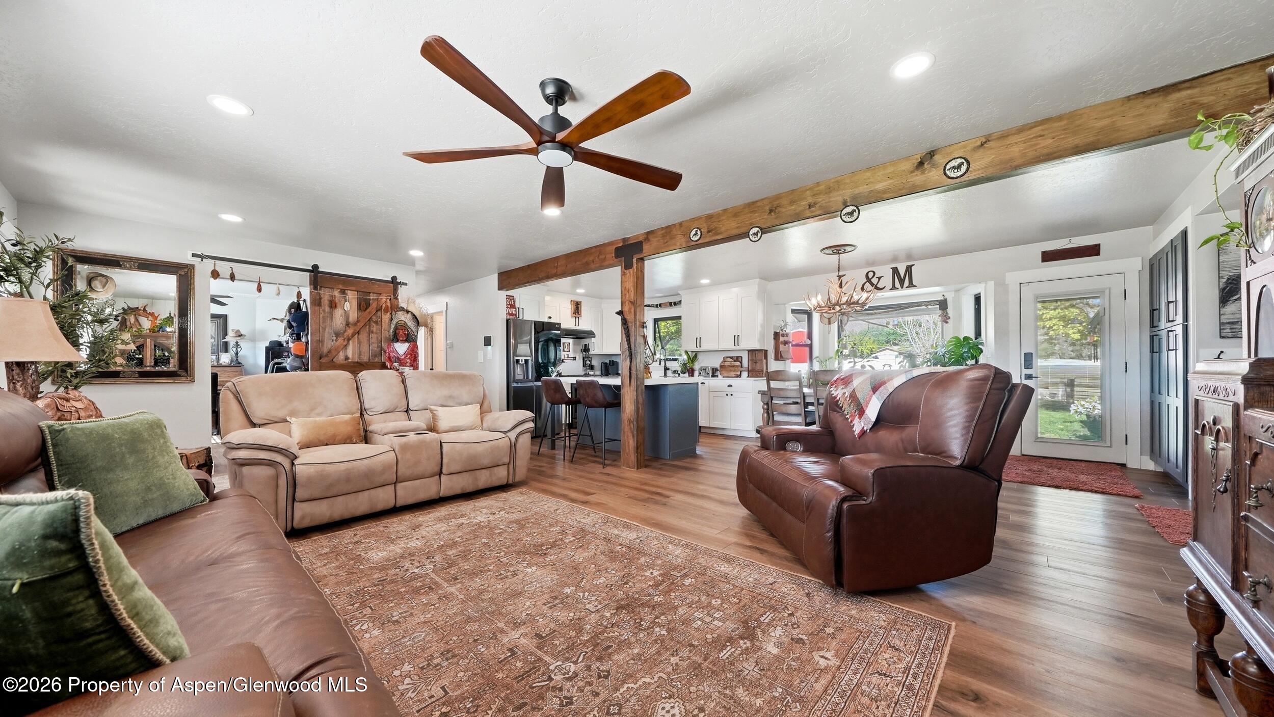 445 South Camp Road Grand Junction, CO 81507 - Photo 6 of 37 a living room with furniture and a large window