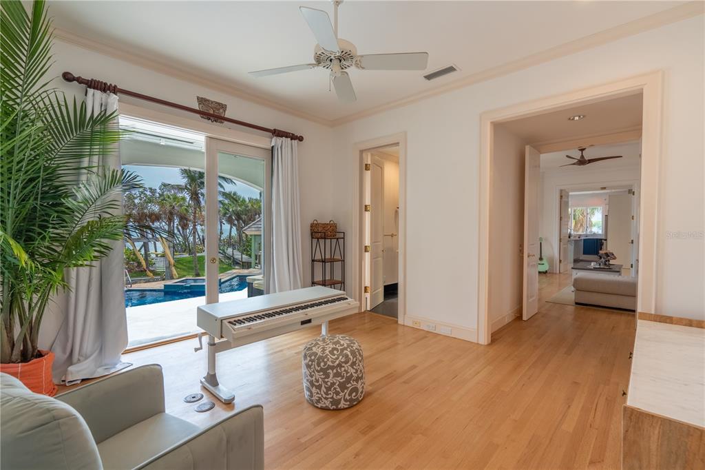 6060 Manasota Key Road Englewood, FL 34223 - Photo 17 of 54 a living room with furniture and a large window