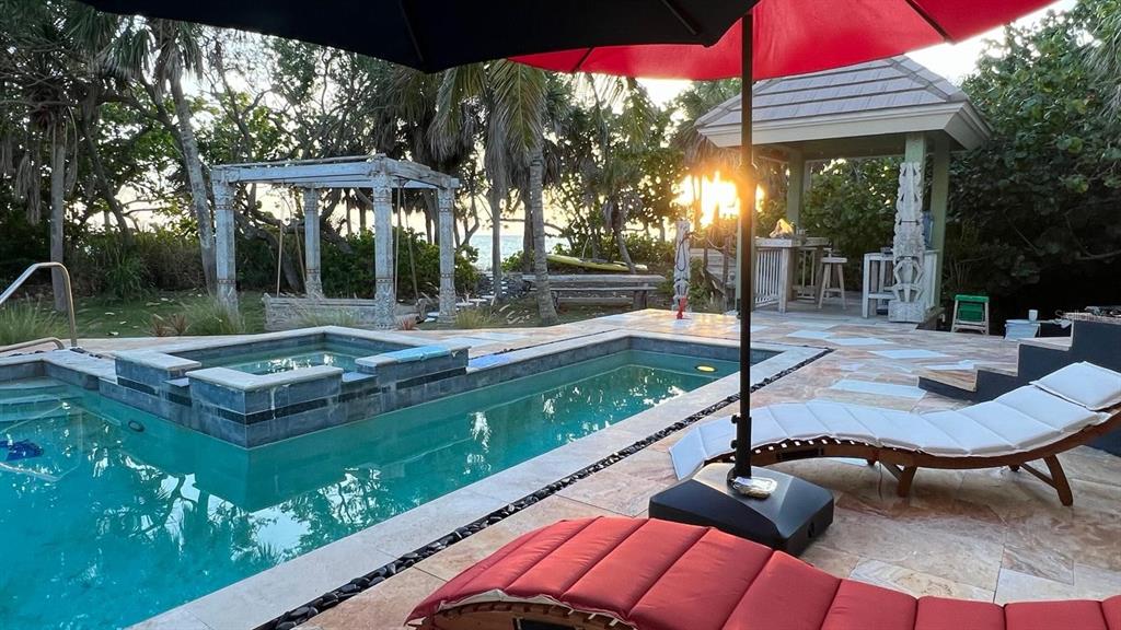 6060 Manasota Key Road Englewood, FL 34223 - Photo 2 of 54 a view of a backyard with sitting area