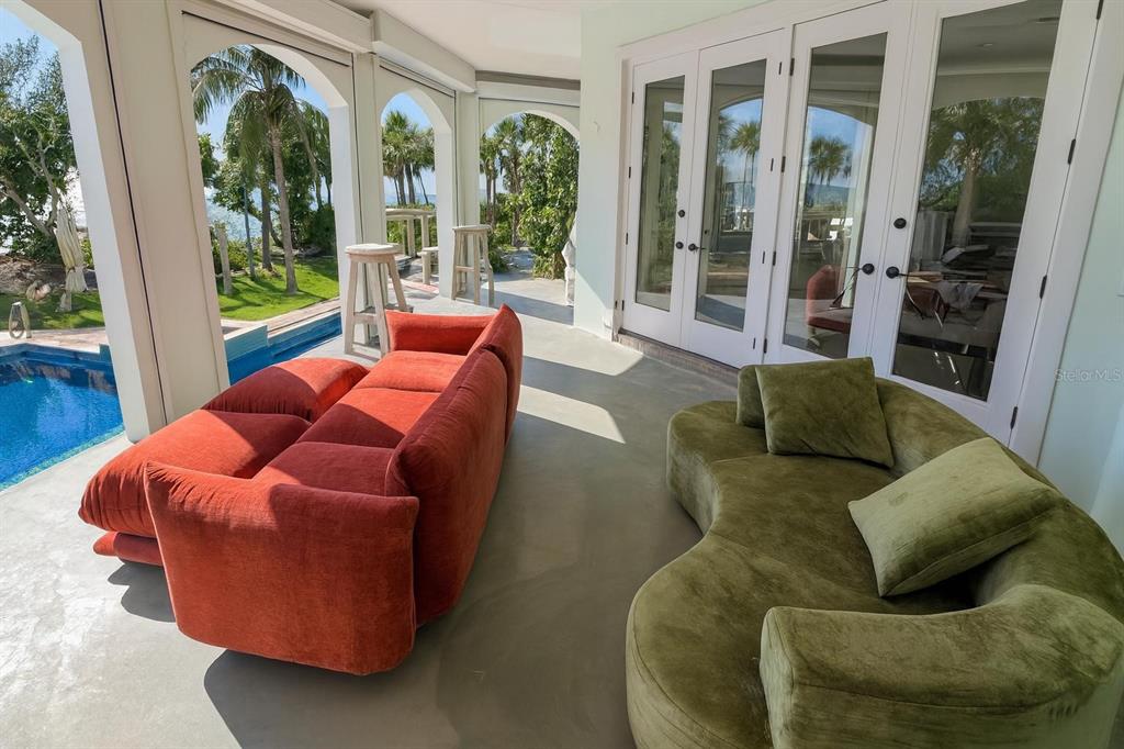 6060 Manasota Key Road Englewood, FL 34223 - Photo 23 of 54 a living room with furniture and a large window