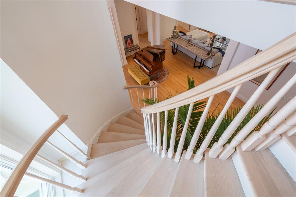 6060 Manasota Key Road Englewood, FL 34223 - Photo 26 of 54 a view of stairs with wooden floor