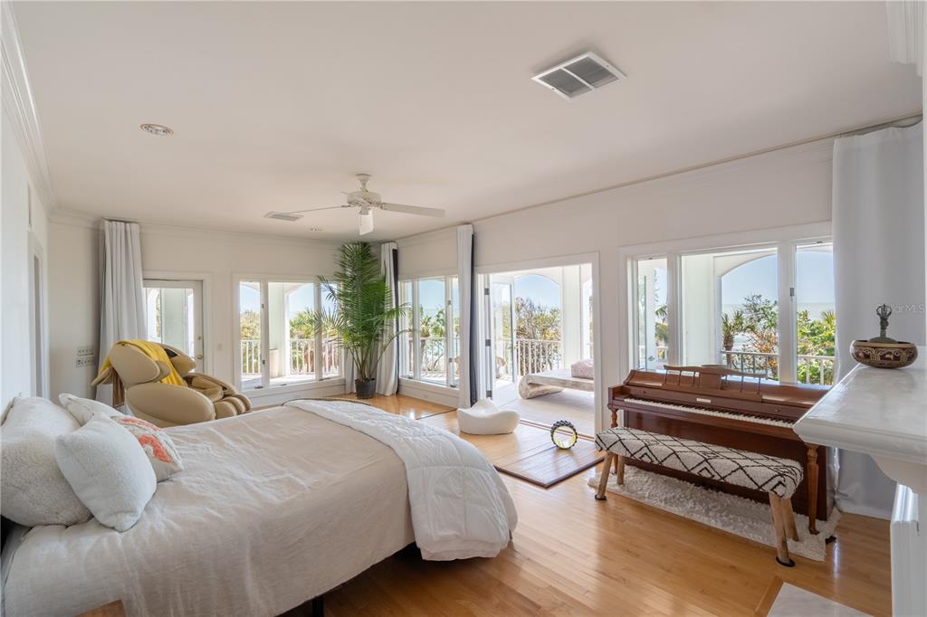 6060 Manasota Key Road Englewood, FL 34223 - Photo 29 of 54 a bedroom with a bed and a large window