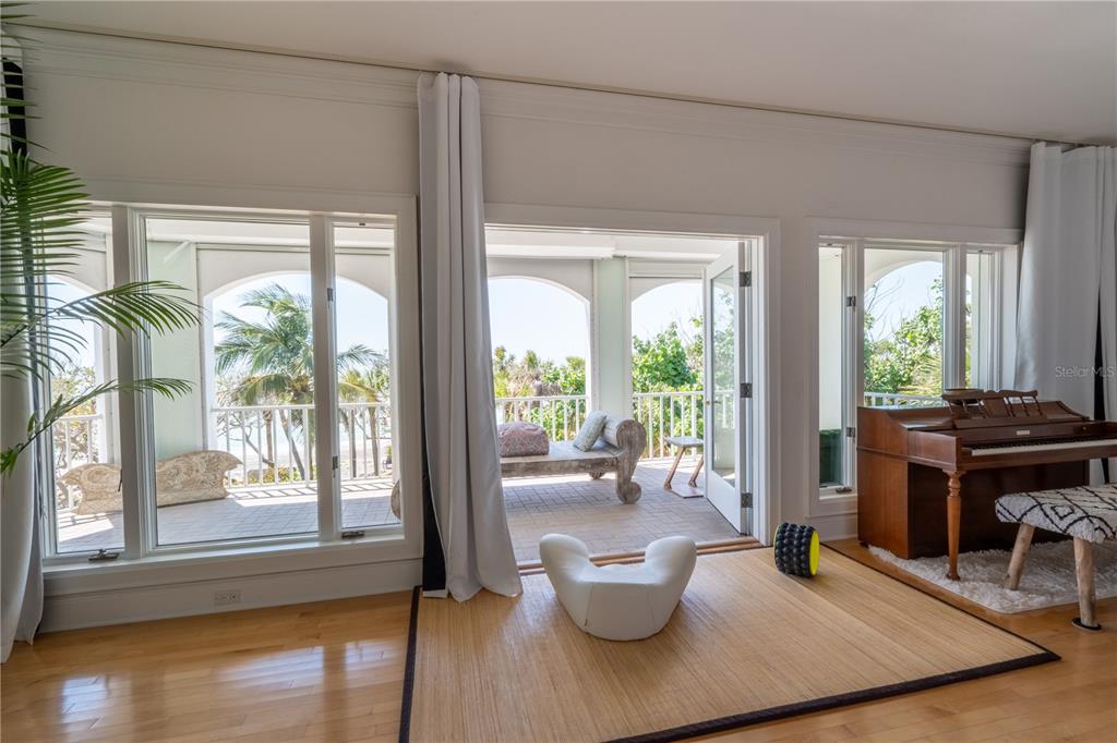 6060 Manasota Key Road Englewood, FL 34223 - Photo 32 of 54 a living room with furniture and a large window