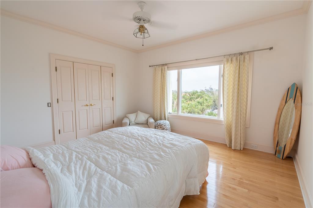 6060 Manasota Key Road Englewood, FL 34223 - Photo 34 of 54 a bedroom with a bed and a window