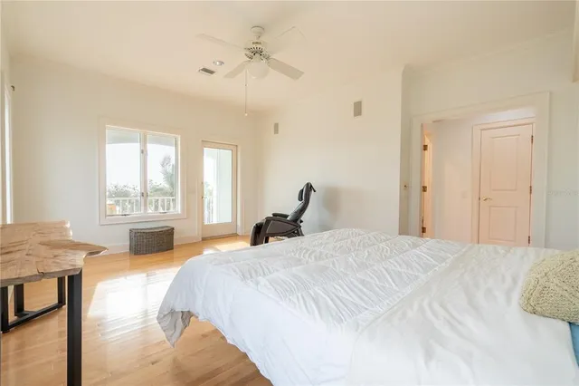 a bedroom with furniture and a chandelier