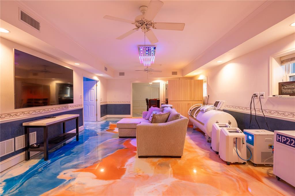 6060 Manasota Key Road Englewood, FL 34223 - Photo 42 of 54 a living room with furniture and a flat screen tv