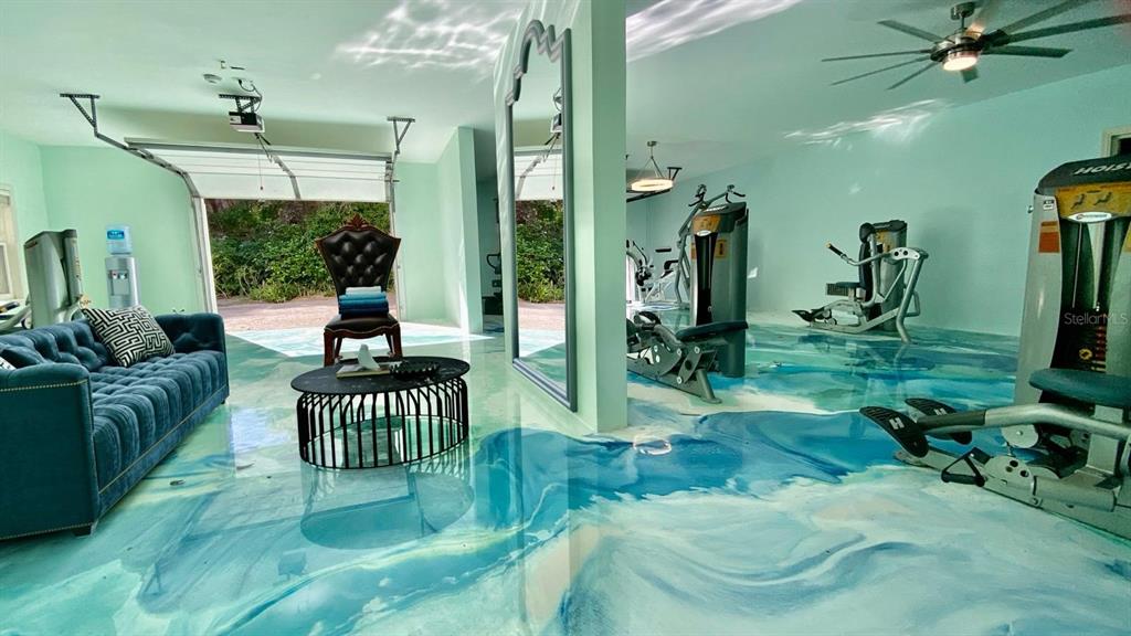 6060 Manasota Key Road Englewood, FL 34223 - Photo 5 of 54 a living room with lots of furniture and a chandelier