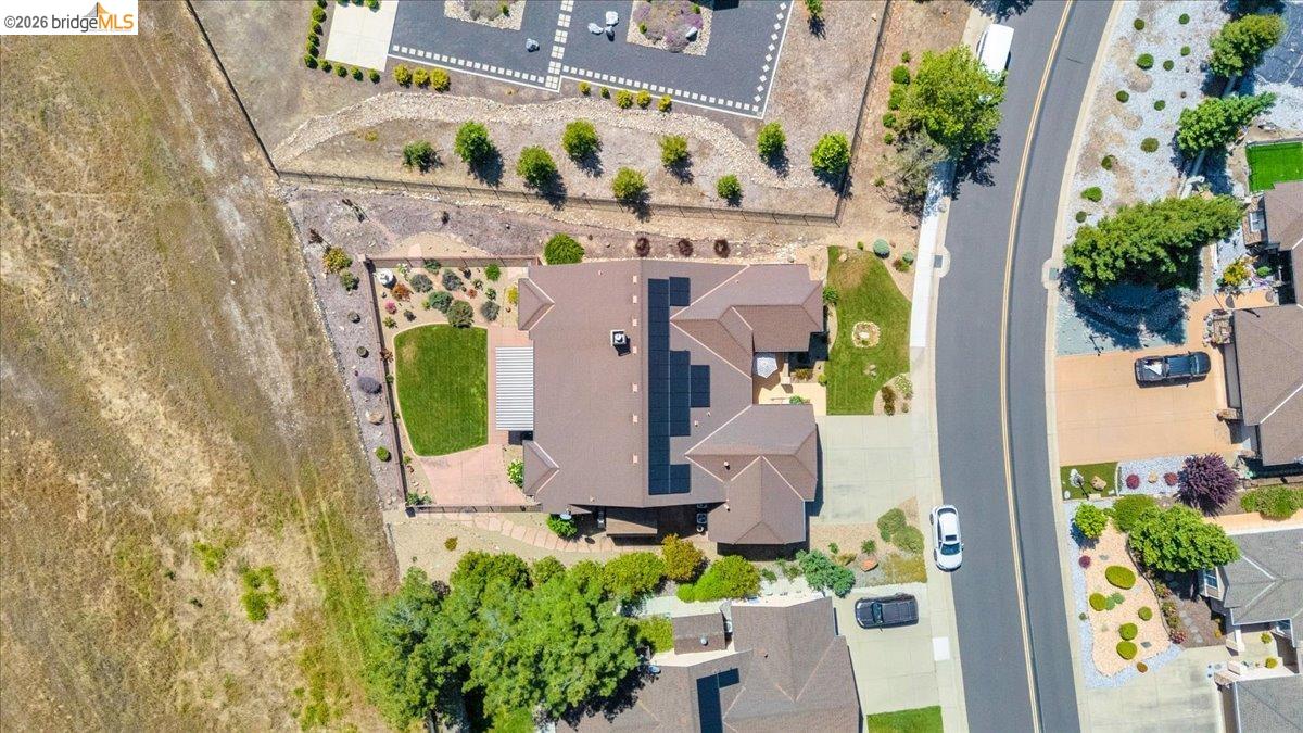 158 Rock Ridge Lane Copperopolis, CA 95228 - Photo 65 of 72 Aerial perspective showcasing a property with a brown tile roof and integrated solar panels