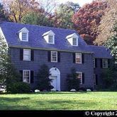 a brick building with a yard