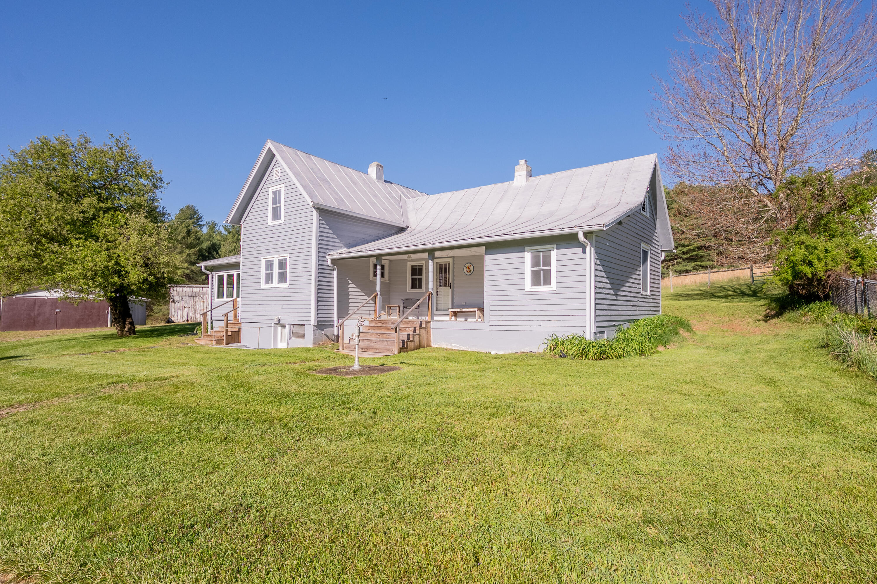 2012 Stonewall Road Northeast Check, VA 24072 - Photo 2 of 83 a front view of a house with a garden