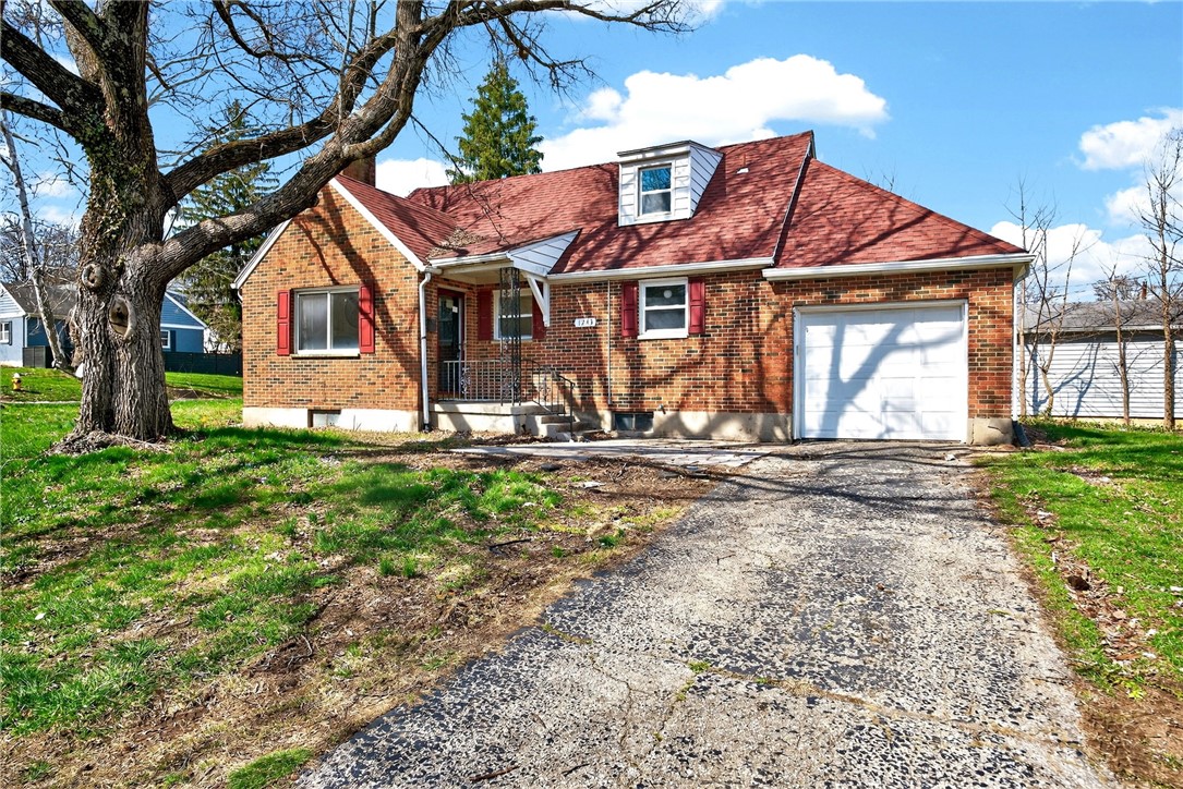 1243 Ridgeview Avenue Dayton, OH 45409 - Photo 51 of 56 This classic brick residence features a durable red roof, an attached garage, and a welcoming front porch.