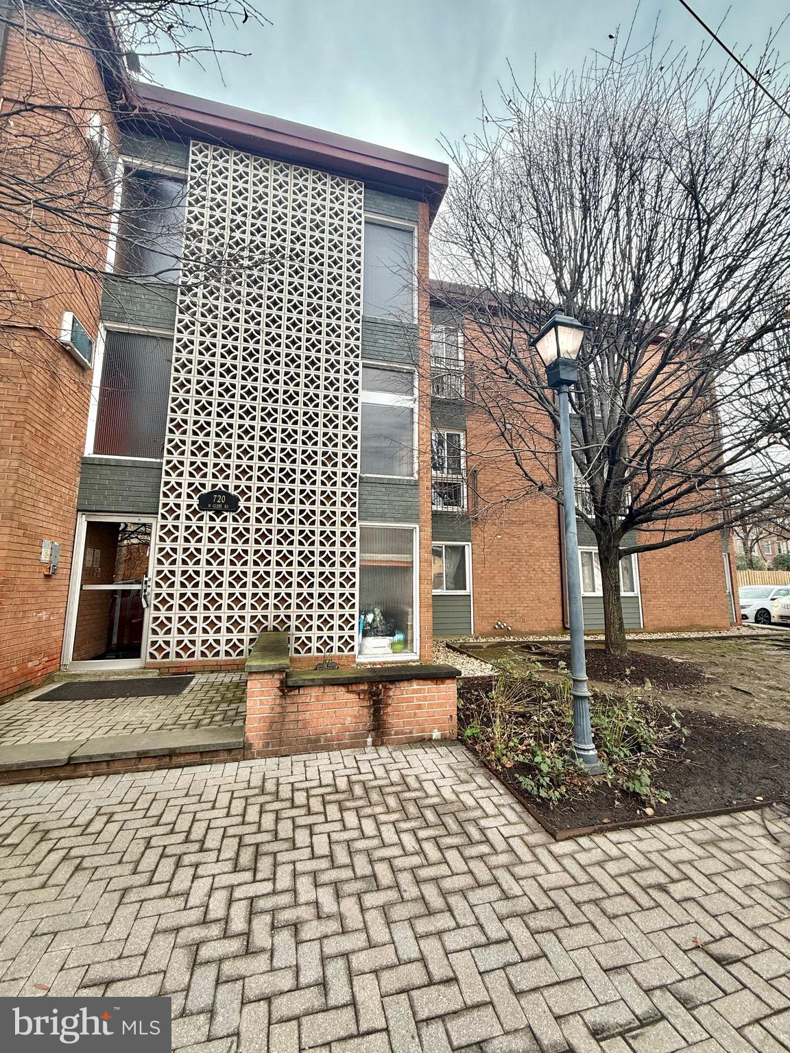 720 West Glebe Road, Unit 2A Alexandria, VA 22305 - Photo 12 of 15 a front view of a house with a yard