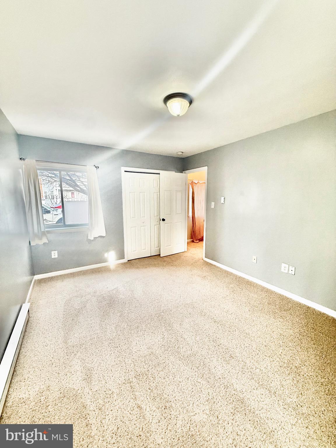 720 West Glebe Road, Unit 2A Alexandria, VA 22305 - Photo 8 of 15 an empty room with a empty space and window