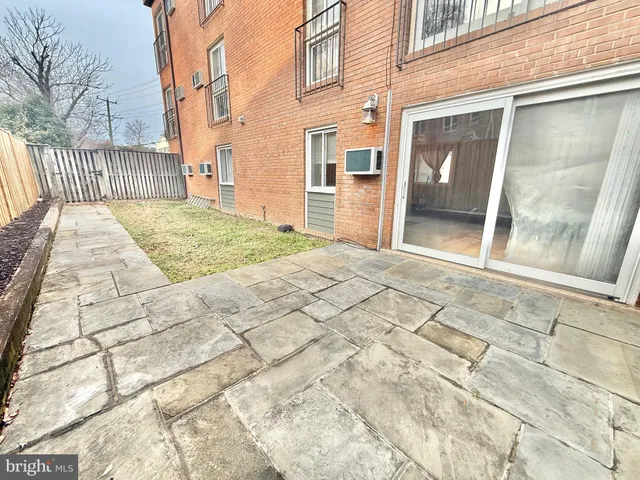 a view of a brick house with a large door