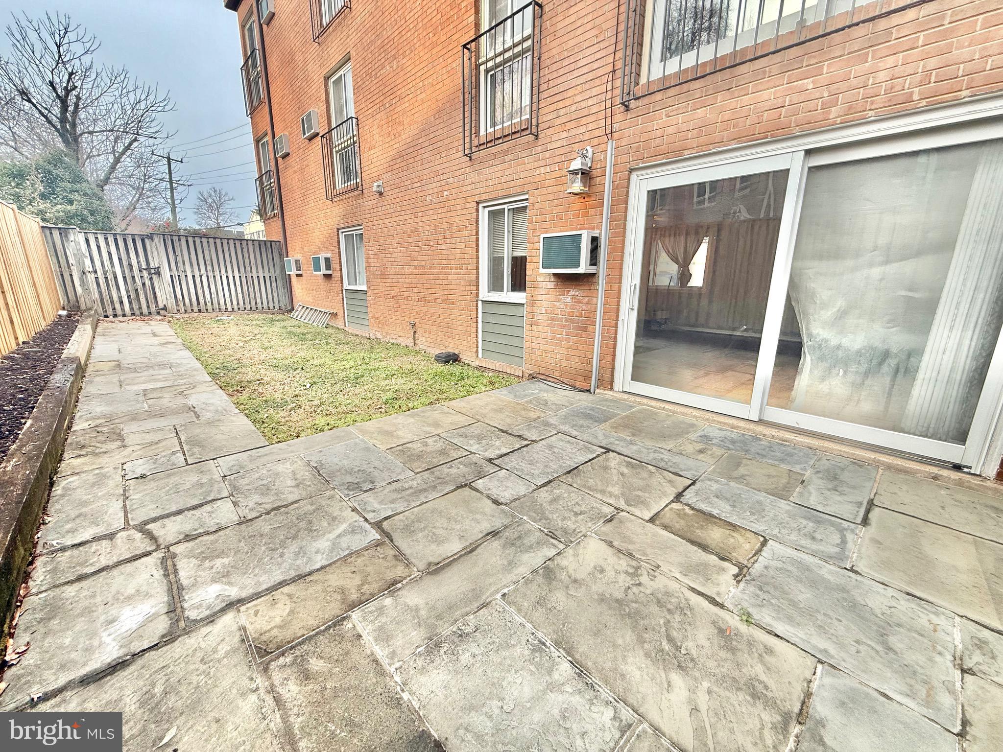 720 West Glebe Road, Unit 2A Alexandria, VA 22305 - Photo 9 of 15 a view of a brick house with a large door
